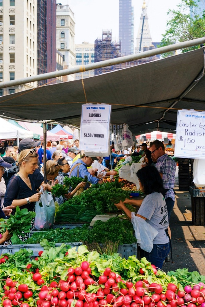 Locals and operators at a busy produce market